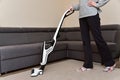 Woman cleaning the living room with vacuum cleaner Royalty Free Stock Photo