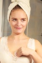 Woman cleaning neckline with cotton swab pad Royalty Free Stock Photo