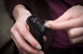 Woman Cleaning old persian carpet by hover at home Royalty Free Stock Photo