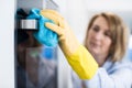 Close Up Of Woman Cleaning Oven In Kitchen Royalty Free Stock Photo