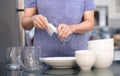 Woman Cleaning product concept wiping dishware cleaner in home a Royalty Free Stock Photo