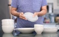 Woman Cleaning product concept wiping dishware cleaner in home a Royalty Free Stock Photo