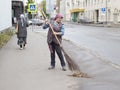 Woman cleaning the street in kazan,russian federation