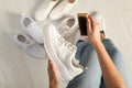 Woman cleaning stylish footwear indoors, closeup. Shoe care accessory Royalty Free Stock Photo