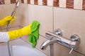 Woman cleaning tiles in bathroom Royalty Free Stock Photo