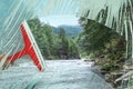 Woman cleaning window with squeegee, closeup. View through clear glass on picturesque mountain river Royalty Free Stock Photo