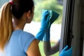 Woman cleaning windows at home Royalty Free Stock Photo