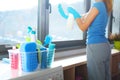 Woman cleaning windows at home Royalty Free Stock Photo