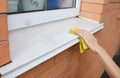 Woman Cleaning  Windows and Window Sills From Dust Royalty Free Stock Photo