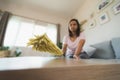 Woman cleaning and wiping the table with microfiber cloth duster in the living room. Woman doing chores at home. Royalty Free Stock Photo