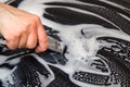 Woman cleans the electronic ceramic hob Royalty Free Stock Photo