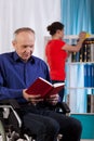 Woman cleans the house the disabled man Royalty Free Stock Photo