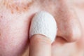 Woman cleans skin with natural silkworm cocoon Royalty Free Stock Photo