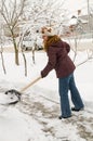 The woman cleans snow.