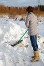 The woman cleans snow