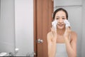 Woman clears a face skin foam on morning Royalty Free Stock Photo