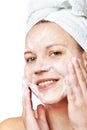 Woman clears a face skin foam Royalty Free Stock Photo