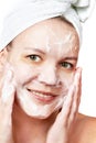 Woman clears a face skin foam Royalty Free Stock Photo