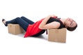 Woman clerk layed asleep on cardboard box