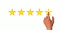 A woman clicks on a star rating, the concept of a positive rating, reviews and feedback