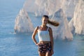 Woman on cliff of Zakynthos island - Agalas, Greece Royalty Free Stock Photo