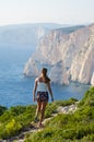 Woman on cliff of Zakynthos island - Agalas, Greece Royalty Free Stock Photo