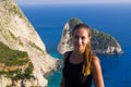 Woman on cliff of Zakynthos island - Agalas, Greece Royalty Free Stock Photo