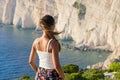 Woman on cliff of Zakynthos island - Agalas, Greece Royalty Free Stock Photo