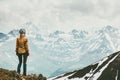 Woman climber enjoying snowy mountains view