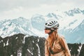 Woman climber in mountains with helmet gear Travel Lifestyle