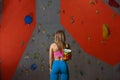 Woman Climber Prepare for Bouldering in the Climbing Gym. Extreme Sport and Indoor Climbing Concept Royalty Free Stock Photo