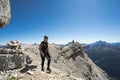 Woman climbers hiking along a rocky summit ridge in the Dolomites of Italy