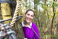 Woman climbing in adventure park