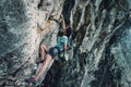 Woman climbing the rock wall Royalty Free Stock Photo