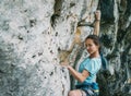 Woman climbing the rock wall Royalty Free Stock Photo