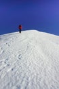 Woman climbing a snow slope