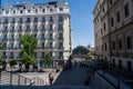 Woman climbing stairs in front of the Reina Sofia Museum with Hotel in the background. Spain. Royalty Free Stock Photo