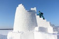 Woman climbing up the steps of a snow tower, Novosibirsk, Russia