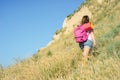 A woman climbs the hill Royalty Free Stock Photo