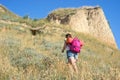 A woman climbs the hill Royalty Free Stock Photo