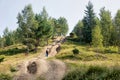 Woman climbs the path to the top of the mountain