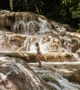 Woman climbs in a waterfall