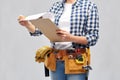 Woman with clipboard, pencil and working tools Royalty Free Stock Photo
