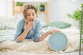 Woman with clock in the bedroom Royalty Free Stock Photo