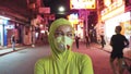 Woman close up look caucasian at Pattaya Walking Street with wearing protective medical mask. Lockdown quarantine
