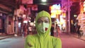 Woman close up look caucasian at Pattaya Walking Street with wearing protective medical mask. Lockdown quarantine