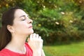 Woman with closed eyes, praying Royalty Free Stock Photo