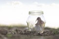 Woman closed in her glass jar feels protected from external dangers Royalty Free Stock Photo