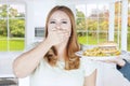 Woman closed mouth for junk food Royalty Free Stock Photo