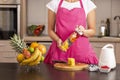 Woman closing a blender bowl before making smoothie Royalty Free Stock Photo